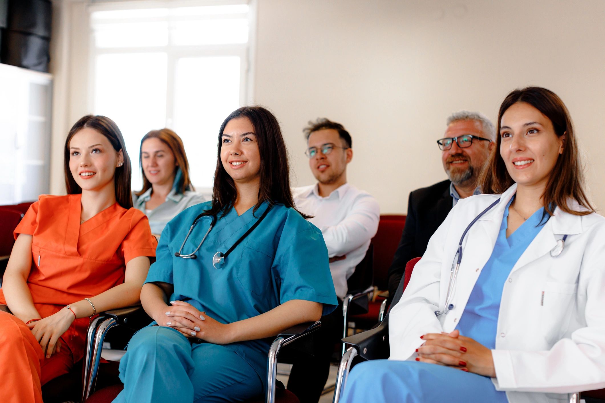 Professionals attending a healthcare quality seminar