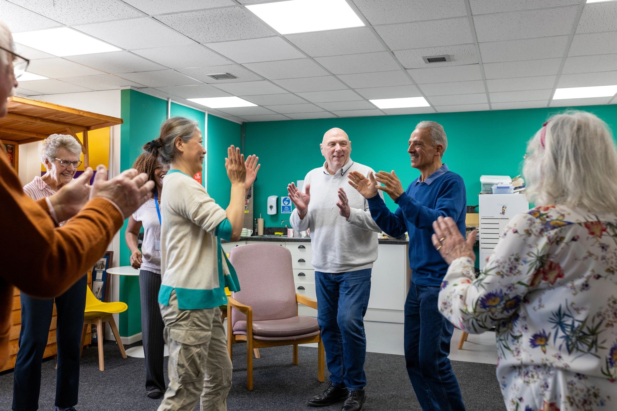 Residential aged care community activity with support staff